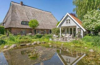 Bauernhaus kaufen in 23738 Beschendorf, Ein beeindruckendes Anwesen, umgeben von gepflegter Natur und einer Architektur, die eine Exklusivität in jedem Detail wiederspiegelt