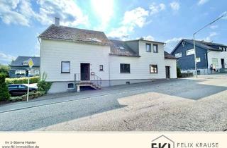 Haus kaufen in 57586 Weitefeld, **Geräumiges Ein-/Zweifamilienhaus mit Garagen, Carport und großem Grundstück in Weitefeld**