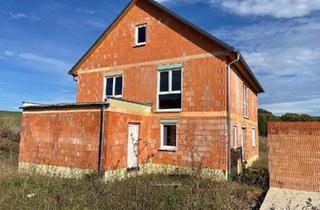 Haus kaufen in 97516 Oberschwarzach, Oberschwarzach - Grundstück mit fertigem Rohbau in bester Lage in 97516