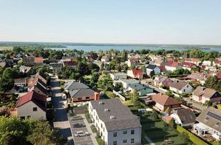 Wohnung kaufen in Ackerstraße 7, 06774 Muldestausee, Muldestausee/ Pouch - Exklusive Erdgeschosswohnung mit Terrasse und eigenem Garten am Ufer des Muldestausees in Pouch