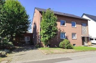 Mehrfamilienhaus kaufen in 41569 Rommerskirchen, Rommerskirchen - 3-Familienhaus mit großem Garten, Garage und separatem Gewerberaum