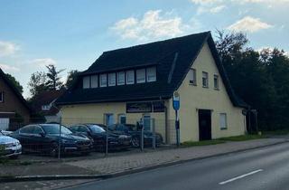 Haus kaufen in 32584 Löhne, Löhne - Freistehendes Zweifamilienhaus mit Gewerbe und Baugrundstück